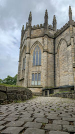 Low angle view of old building against sky