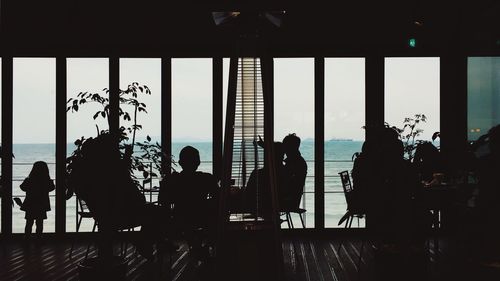 Silhouette of people at sunset