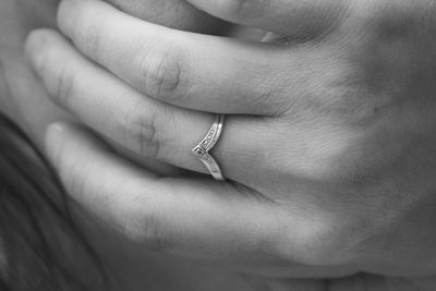 Close-up of couple holding hands