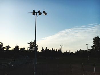 Low angle view of floodlight against sky