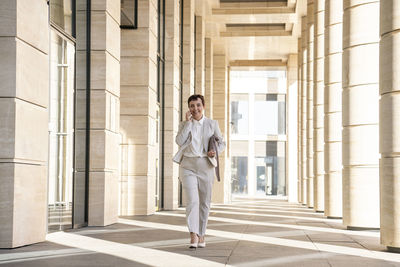Portrait of man standing in corridor
