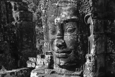 Old statue against temple