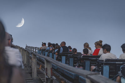 Group of people against clear sky