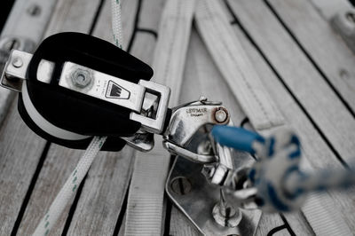 Close-up of motorcycle on wood