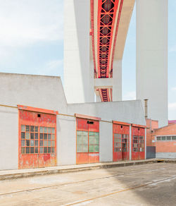 Low angle view of bridge and building against sky