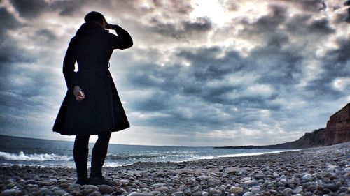 Woman standing on beach