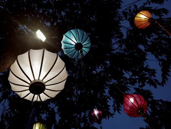 Low angle view of illuminated lanterns hanging on ceiling