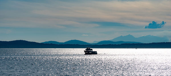 Scenic view of sea against mountains