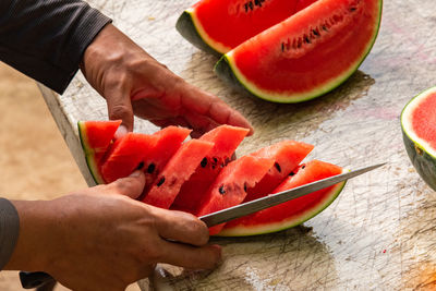Midsection of man preparing food on table