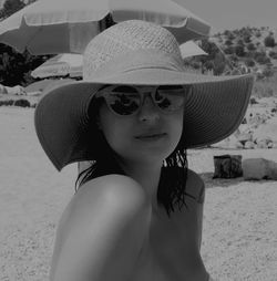 Close-up portrait of woman wearing hat