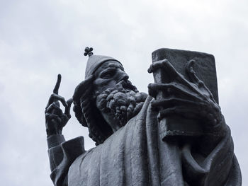 Low angle view of statue against sky