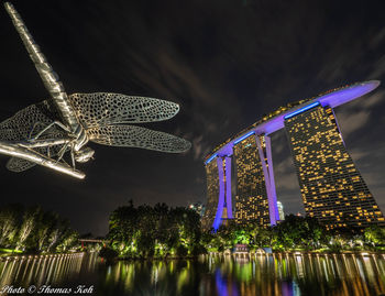 Low angle view of illuminated buildings at night