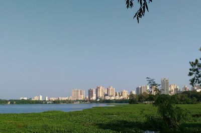 Scenic view of city buildings against clear sky