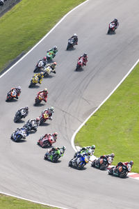 High angle view of people riding motorcycles on road