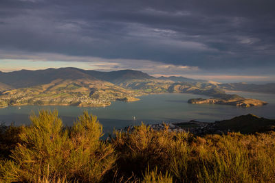 Scenic view of lake and mountains against sky