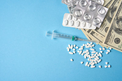 Close-up of coins on blue background