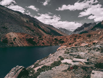 Scenic view of lake and mountains against sky