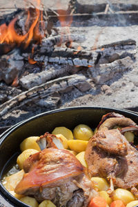 Cooking of traditional croatian meal peka in metal pots called sac, sach or sache. 