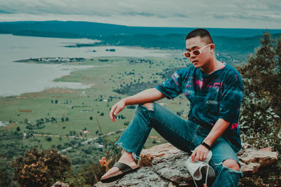 Man sitting on rock