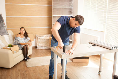 Side view of man working at home