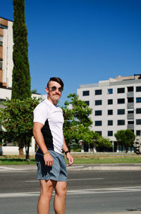 Young happy handsome bearded man, tourist relaxing in city koper. summer vacation. sunglasses.