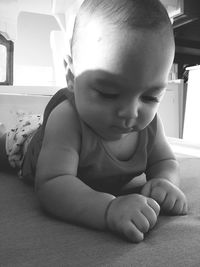 Cute boy relaxing on bed at home