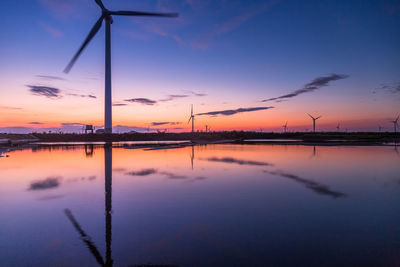 Scenic view of lake against romantic sky at sunset