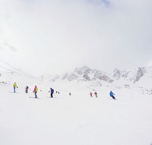 People on snow covered landscape