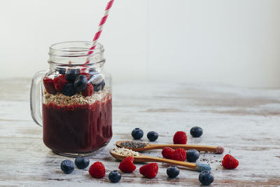 Close-up of fruits in jar on table