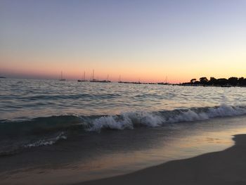 Scenic view of beach at sunset