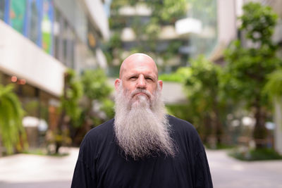 Portrait of man standing outdoors