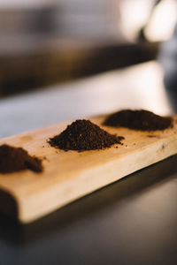 High angle view of ground coffee on wood