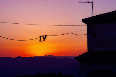 Scenic view of silhouette mountain against sky during sunset