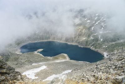 Scenic view of mountains in foggy weather