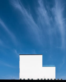 Low angle view of building against blue sky