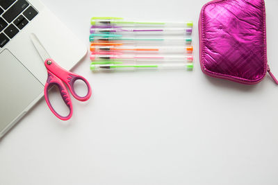 Close-up of colored pencils over white background