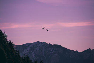 Scenic view of mountains against sky at sunset