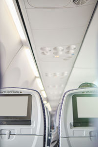 Crop image of airplane screen device for entertainment to serve passenger. flying with airplane. 