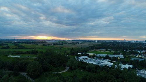 High angle view of buildings against sky during sunset