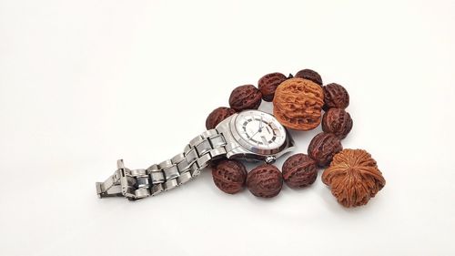 High angle view of candies against white background