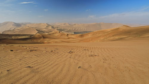 1181 sand megadunes overlook the s-w-e.shores of sumu barun jaran lake. badain jaran desert-china.