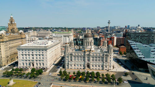 High angle view of buildings in city against clear sky