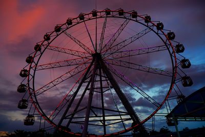 Low angle view of ferris wheel against sky