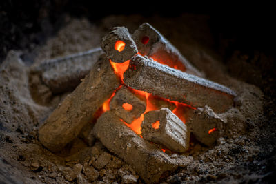High angle view of fire on rock