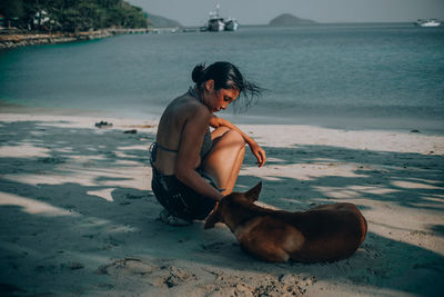 Man with dog at beach