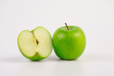 Close-up of granny smith apple against white background