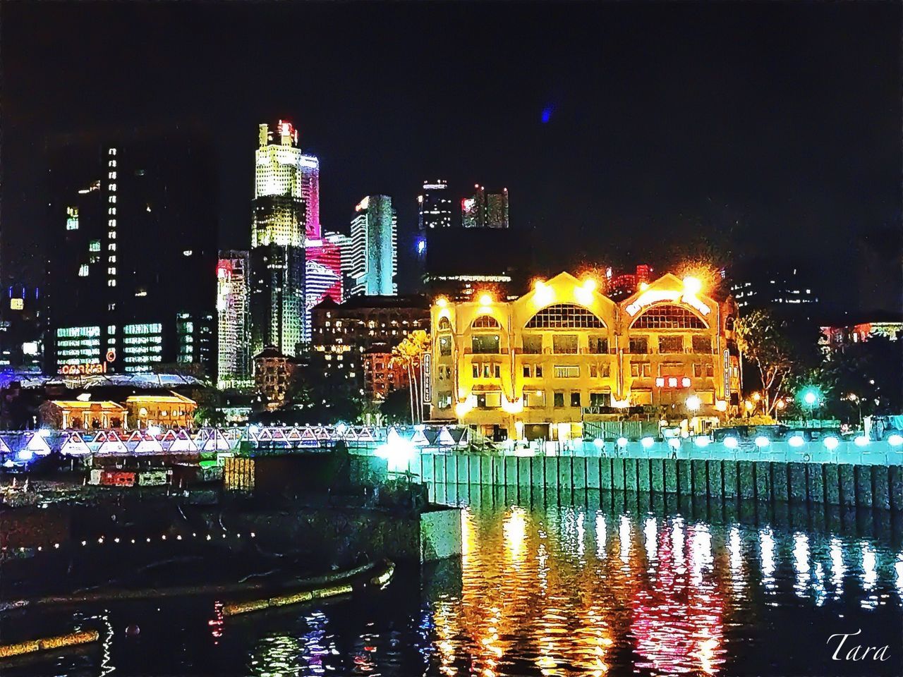 illuminated, night, building exterior, architecture, city, built structure, water, reflection, waterfront, skyscraper, office building, cityscape, modern, tower, tall - high, city life, building, river, sky, capital cities