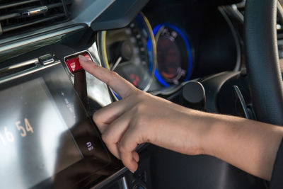 Close-up of woman driving car