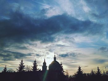 Low angle view of temple against cloudy sky