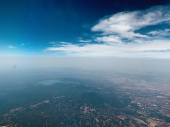 Aerial view of landscape and sea against sky